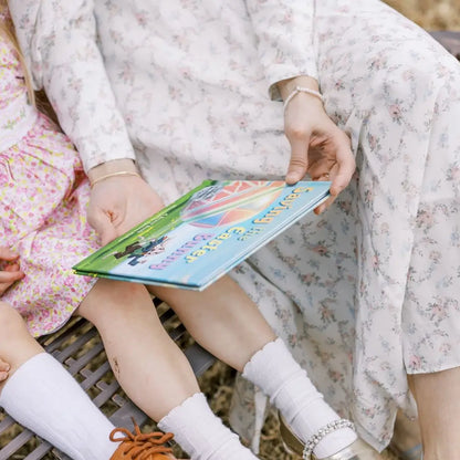 A mom holding 'Saving the Easter Bunny', an Easter allegory by BRAVE Books